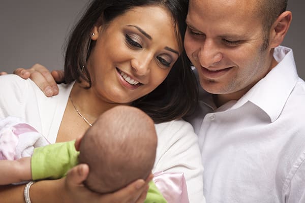 Mixed Race Young Family with Newborn Baby